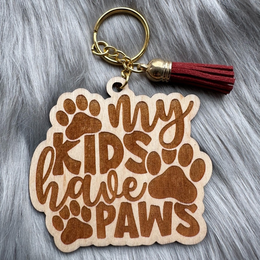 Handmade wood keychain with tassel: My kids have paws